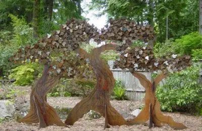 Sculpture nestled within a grove of trees at Big Rock Garden Park