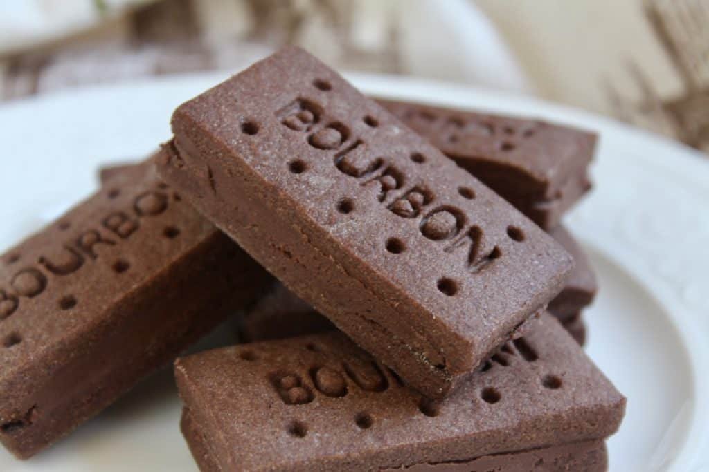 Image link to Bourbon biscuit recipe, featuring a stack of homemade bourbon biscuits, a British classic