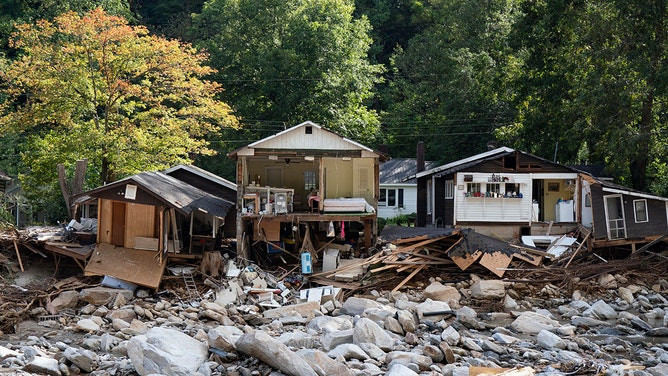 Destroyed houses in Chimney Rock, North Carolina, photographed on October 2, 2024, illustrating the residential damage caused by Hurricane Helene's floodwaters.