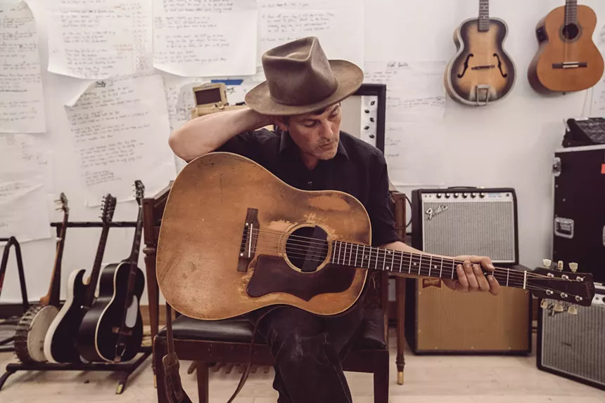 Gregory Alan Isakov portrait with acoustic guitar