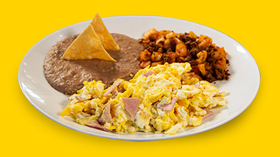 Savory ham and egg breakfast plate at Taco Palenque Round Rock, featuring ham, eggs, beans, and tortillas.