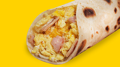 Popular ham and egg breakfast taco at Taco Palenque Round Rock, featuring savory ham and perfectly cooked scrambled eggs.