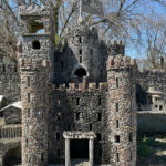 An overview of the whimsical Hartman Rock Garden in Springfield, Ohio, showcasing its unique folk art structures.