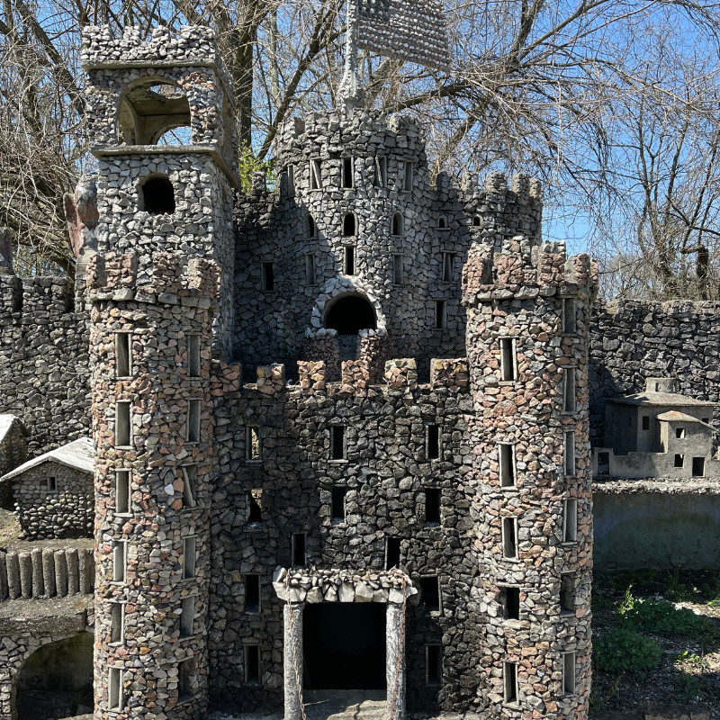 An overview of the whimsical Hartman Rock Garden in Springfield, Ohio, showcasing its unique folk art structures.