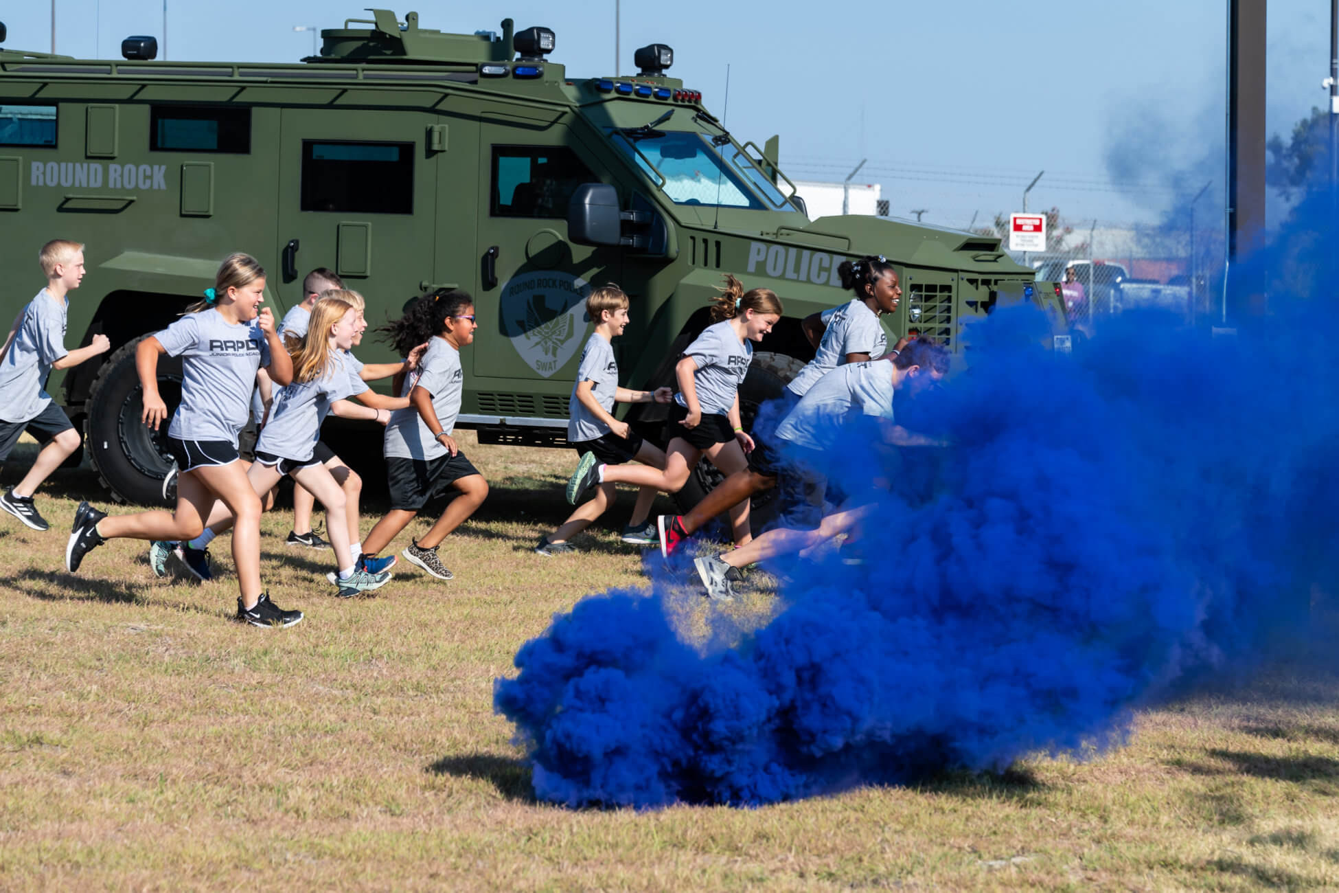 Alt text: Children participating in activities at the Junior Police Academy in Round Rock, Texas.