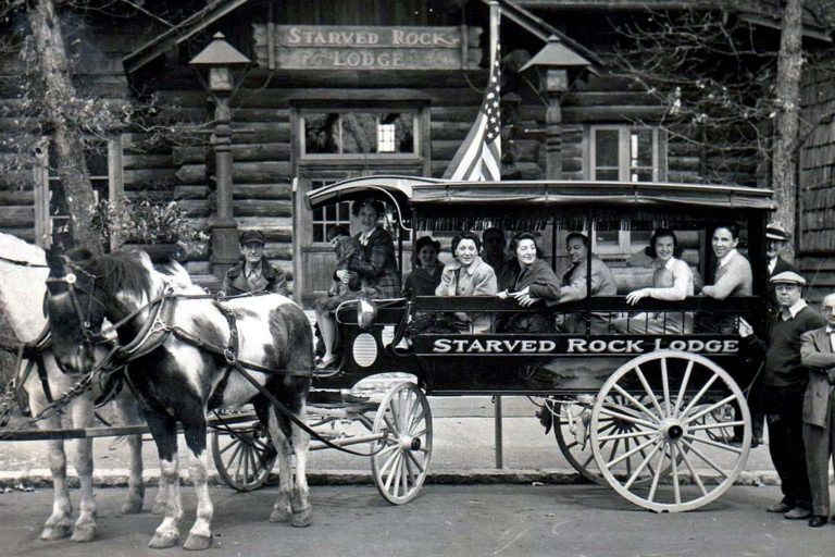 Historic horse-drawn trolley at Starved Rock Lodge, showcasing vintage transportation.