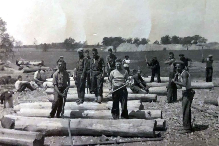 CCC workers building Starved Rock Lodge circa 1935, illustrating the lodge's historic construction.