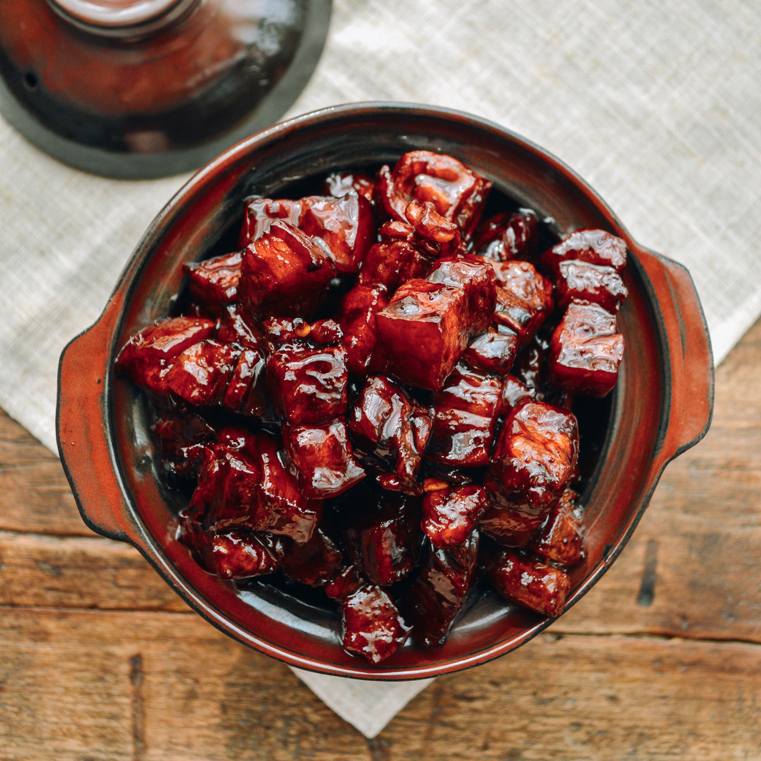 Close-up of glistening Shanghai Braised Pork Belly (Hong Shao Rou) showcasing the shiny glaze from rock sugar.