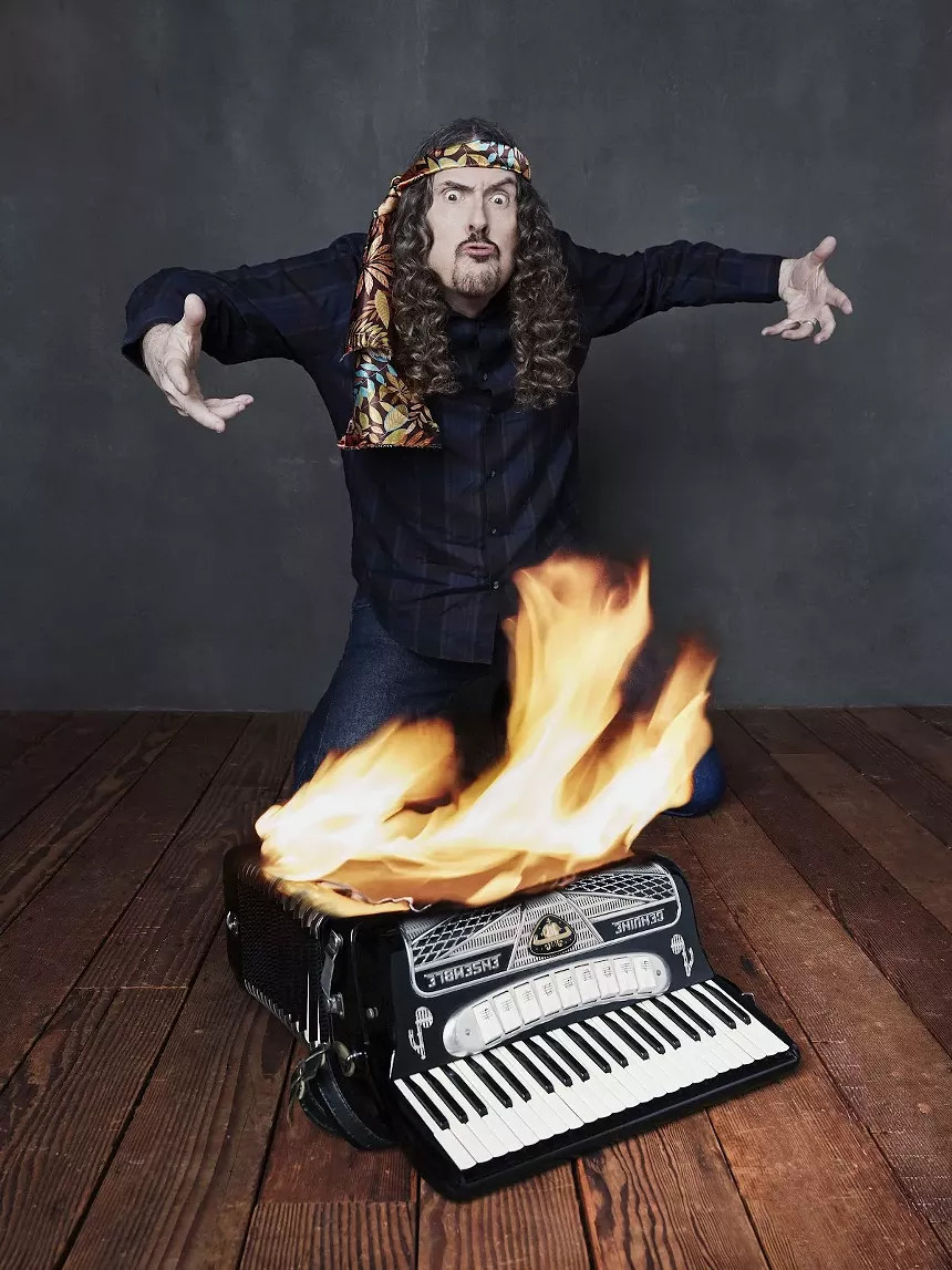 Weird Al Yankovic performing on stage