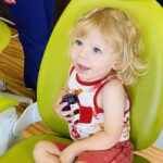 Dr. Jonathan Mitchell, a board-certified pediatric dentist at Rock Hill Pediatrics, warmly greets a young patient, ensuring a comfortable and friendly dental experience.