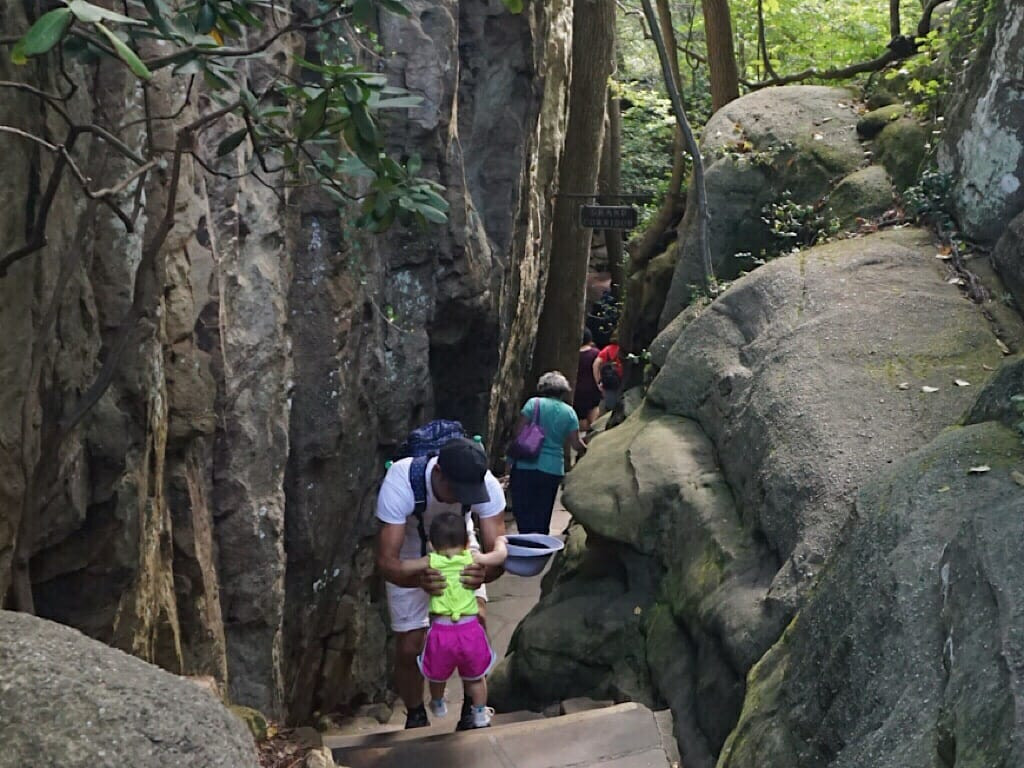 Family exploring the Enchanted Trail at Rock City, enjoying the natural pathways and scenic views