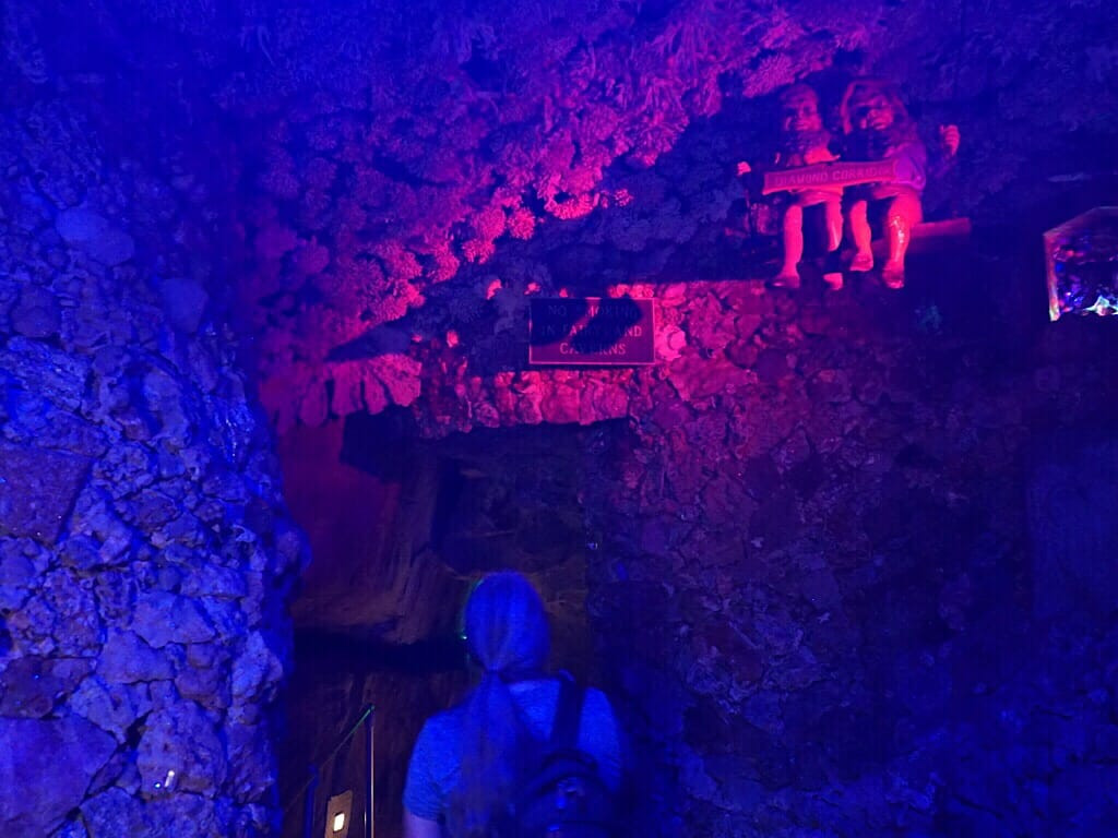 Illuminated vignette of fairy tale characters in Fairyland Caverns