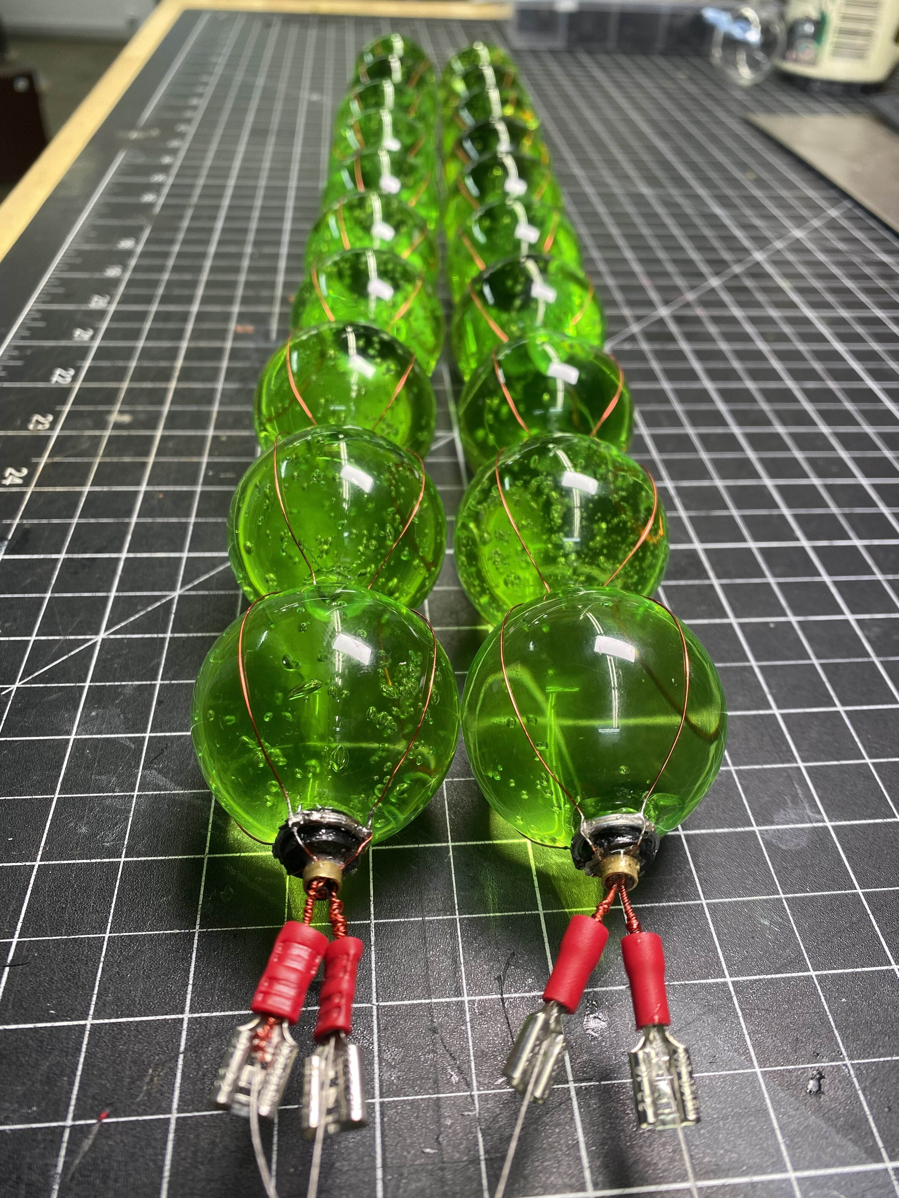 Completed string of pearls vials hanging, ready to be installed in VX canister prop