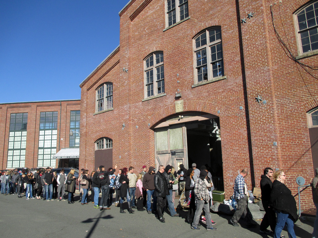 A long line of people waiting to enter the Trenton Punk Rock Flea Market at Roebling Wire Works.