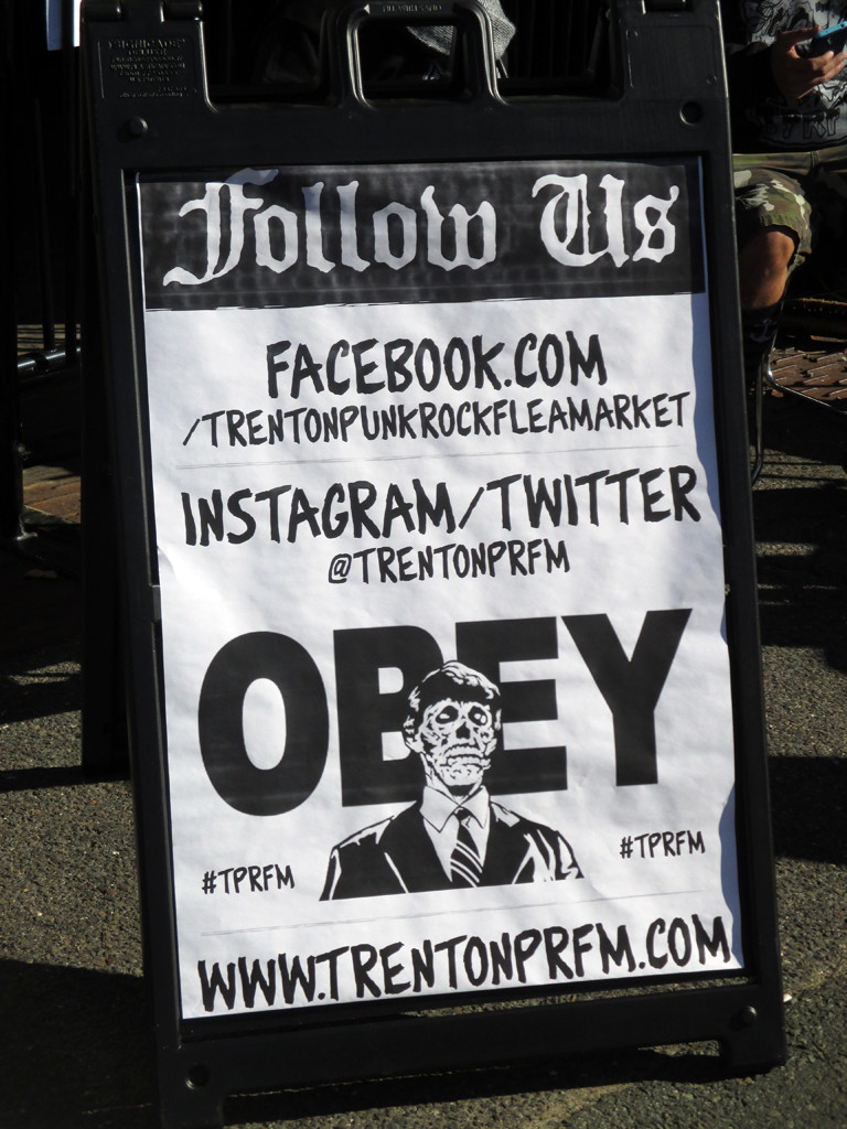 A poster using Shepard Fairey's &quot;Obey&quot; style to advertise the Punk Rock Flea Market.