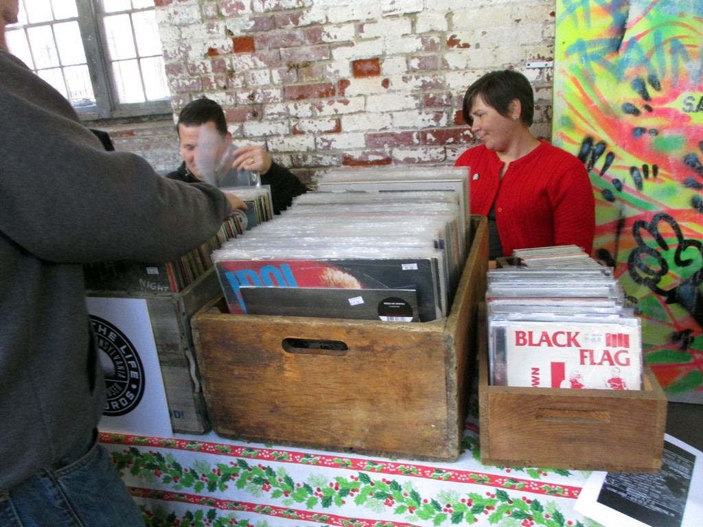 A display of vinyl records featuring Black Flag and Billy Idol, among other artists.