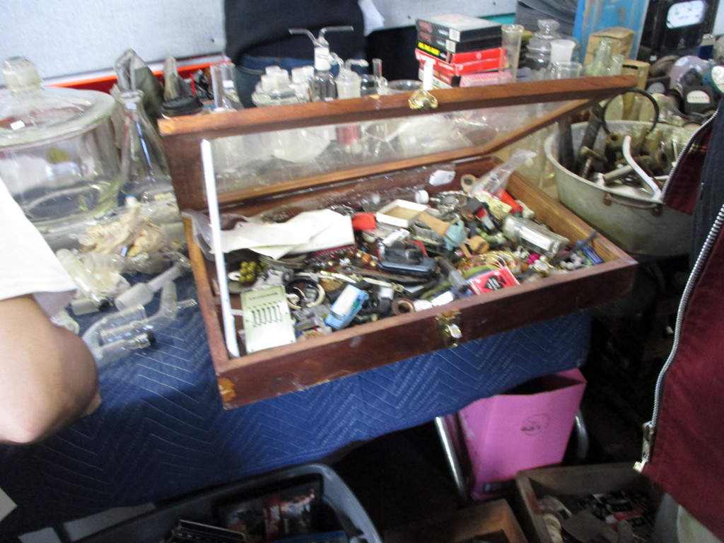 A table displaying antiques from the 19th and early 20th centuries, incongruous with the punk theme.