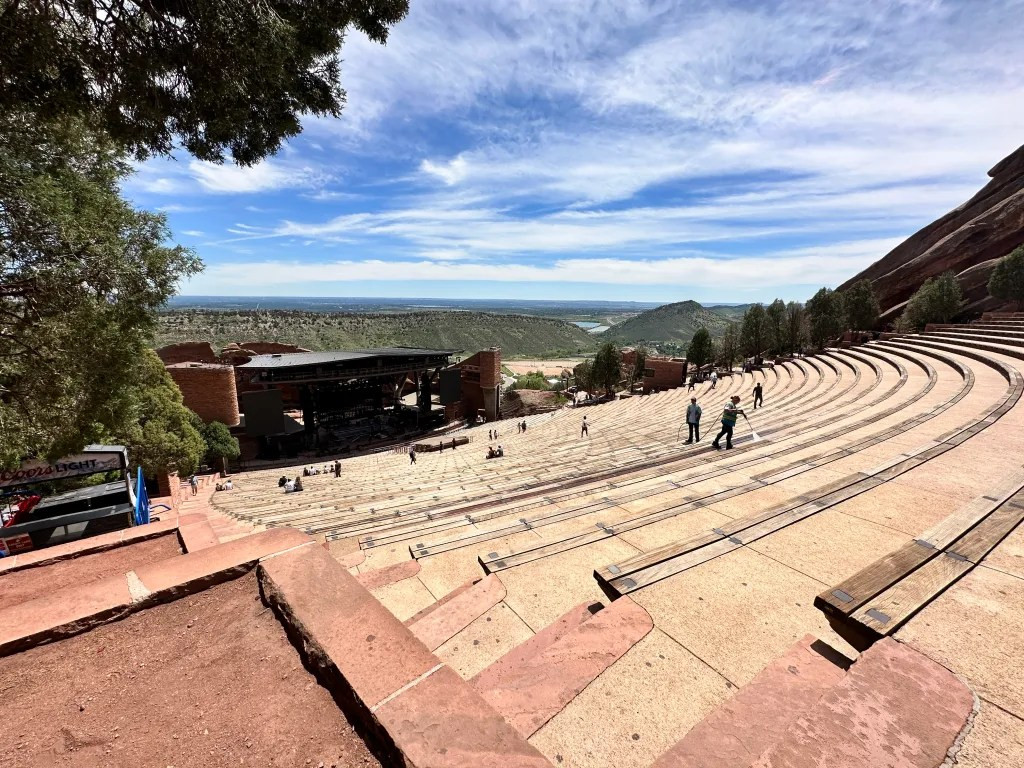 Wide-angle shot from the top of Red Rocks Amphitheater, emphasizing the open and exposed environment.