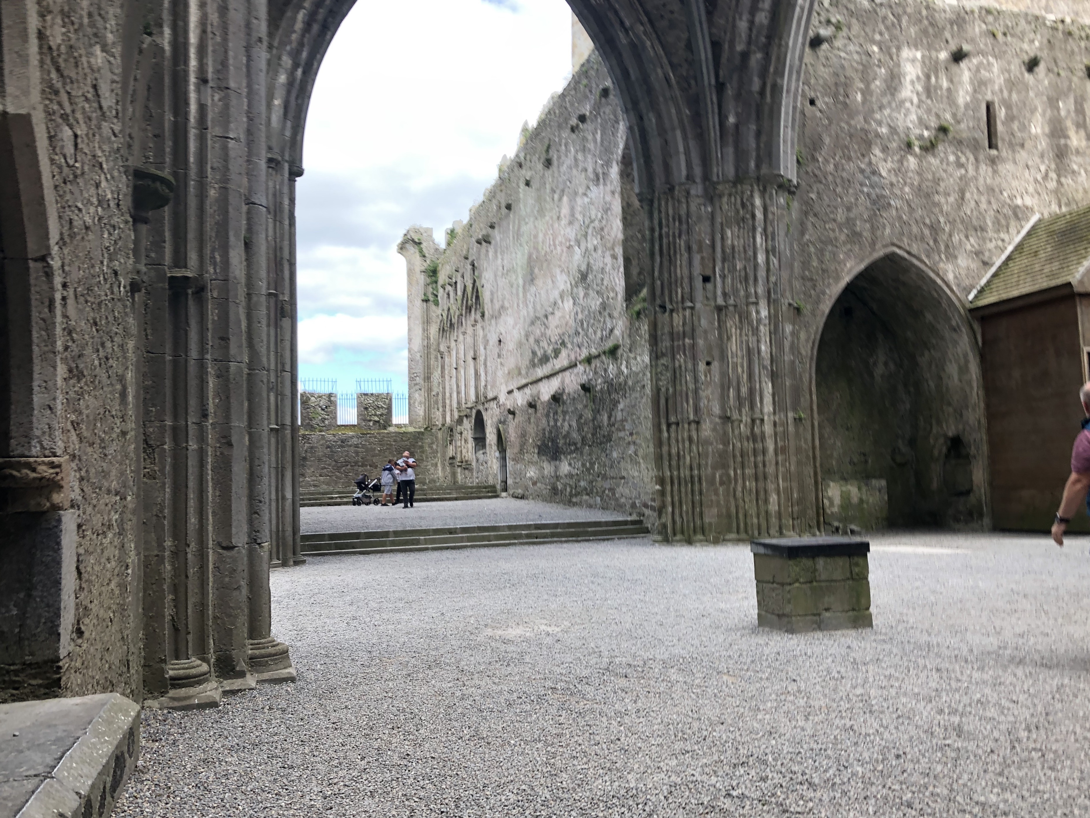 A wider view of the cathedral ruins showing the scale and setting