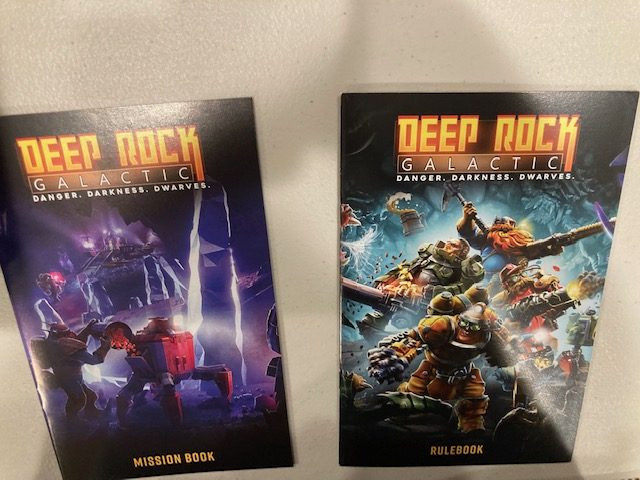 Deep Rock Galactic Board Game Rulebook Close Up -  Detail View of the Rulebook for Deep Rock Galactic Board Game