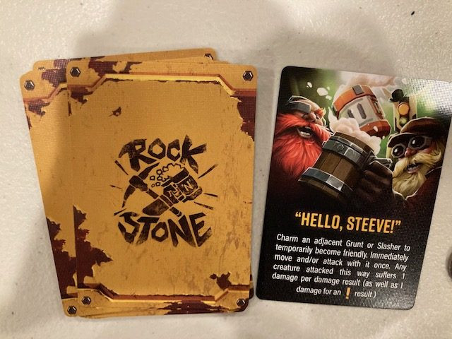 Deep Rock Galactic Board Game Rock and Stone Card Detail -  Close Up of the Rock and Stone Card from Deep Rock Galactic Board Game