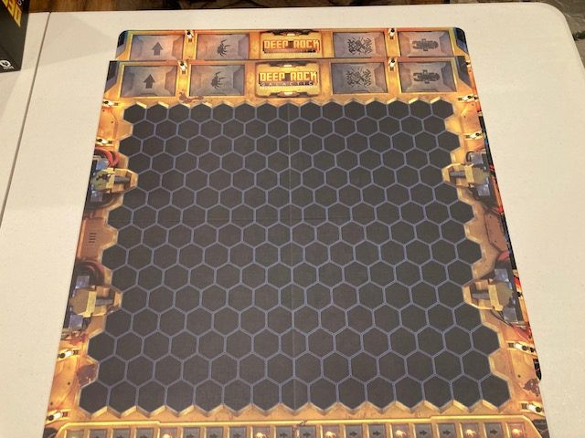 Deep Rock Galactic Board Game Game Mat and Board Overlap -  Game Board Placed on Top of Game Mat Showing Identical Design