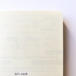 Close-up of the climbing journal highlighting the durable kraft cover and compact size