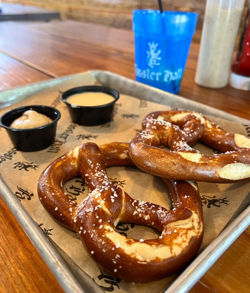 Close-up of Cory Lee enjoying his sausage sampler at Fassler Hall