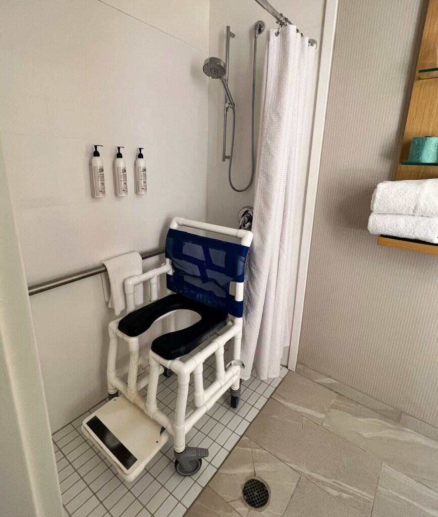 Roll-in shower in an accessible hotel bathroom at Delta Hotels, Little Rock