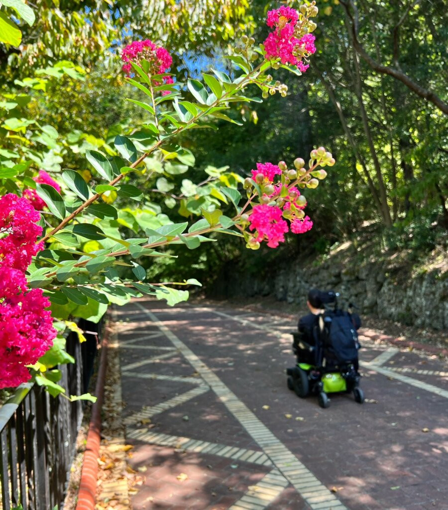 Cory Lee rolling along the Grand Promenade trail