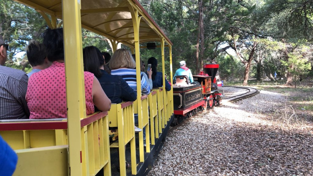 Covered train seats on Cedar Rock Railroad miniature train ride