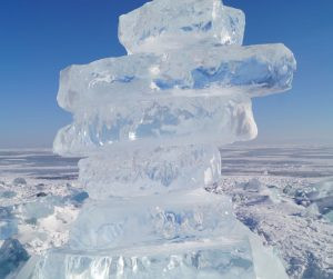 A large block of clear ice, showcasing its transparency and potential for use in ice sculptures or drinks.