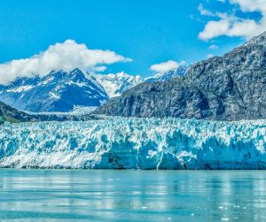 A vast glacier landscape with crevasses and snow, illustrating the scale and metamorphic nature of glacial ice.