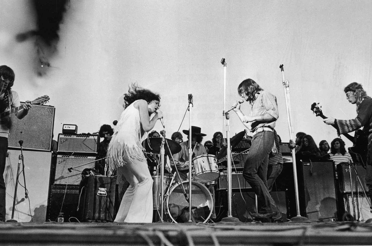 Grace Slick of Jefferson Airplane in a 1969 performance, alt text: Grace Slick of Jefferson Airplane, psychedelic rock pioneer, performs with commanding stage presence in 1969.