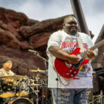 Christone "Kingfish" Ingram performing blues guitar at Red Rocks Amphitheatre as the opening act for Vampire Weekend.