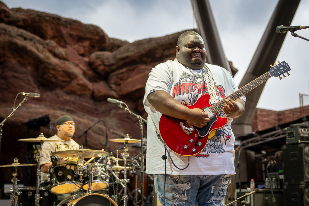 Christone "Kingfish" Ingram performing blues guitar at Red Rocks Amphitheatre as the opening act for Vampire Weekend.