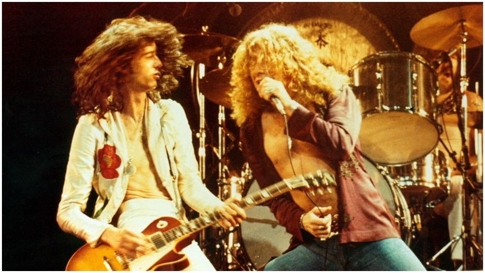 Led Zeppelin band members Jimmy Page, Robert Plant, and John Paul Jones reflect on their early years and musical journey in the 'Becoming Led Zeppelin' documentary, solidifying their place among the greatest rock bands.