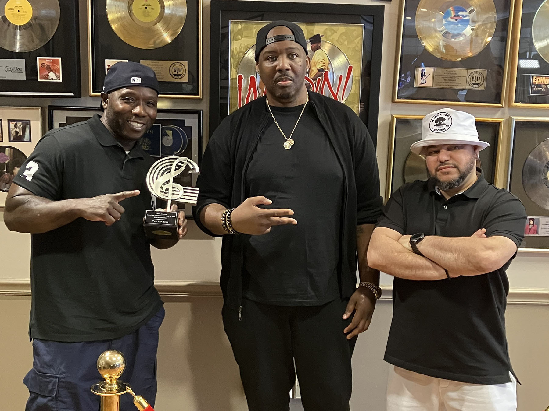 Kool Rock-Ski accepting the induction to the Long Island Music and Entertainment Hall of Fame for The Fat Boys from Erick Sermon, with DJ Johnny Juice on stage