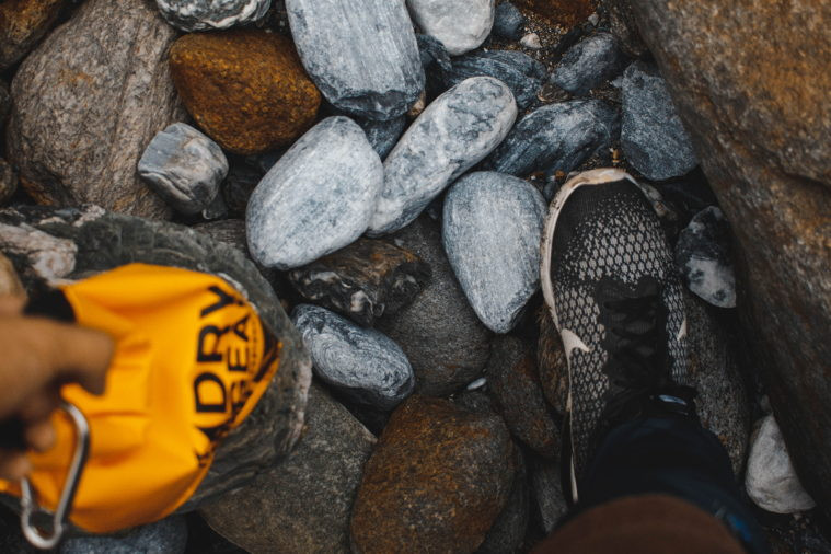 bag and rocks on beach