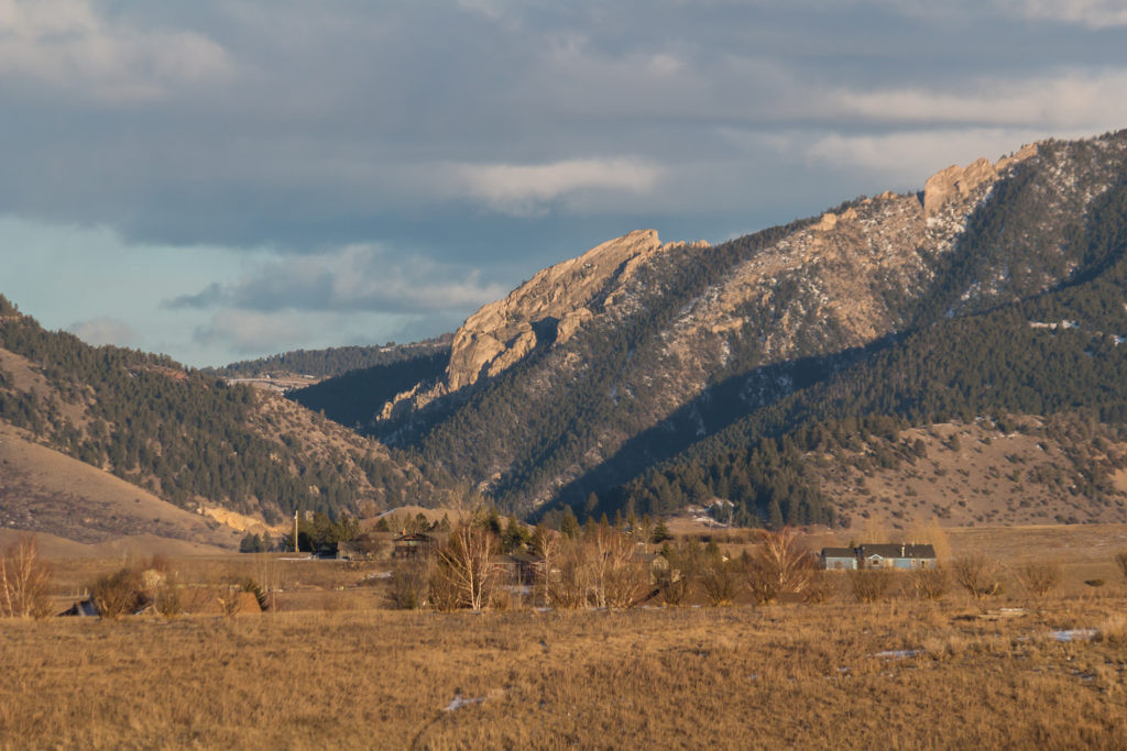 Frog Rock from a distance, showcasing its unique shape and the surrounding landscape.