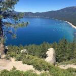 Monkey Rock granite formation resembling a monkey's head, with scenic views of Crystal Bay, Lake Tahoe.