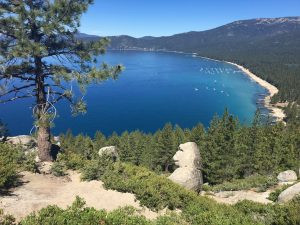 Monkey Rock granite formation resembling a monkey's head, with scenic views of Crystal Bay, Lake Tahoe.