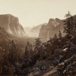 Eadweard Muybridge's 1872 photograph from Moonlight Rock, Yosemite Valley. The image captures the expansive view, although early photographic limitations obscure Sentinel Rock due to blue-sensitive emulsions and atmospheric haze.