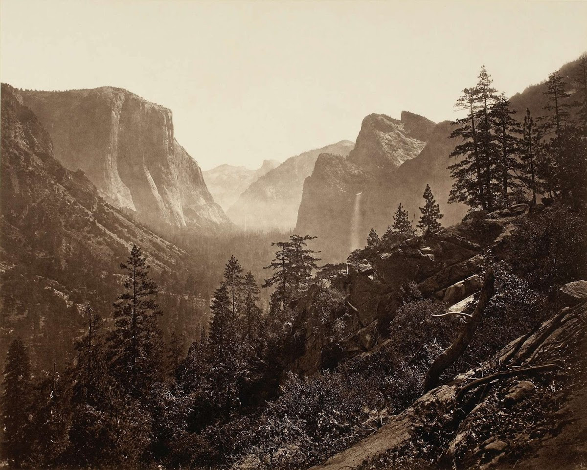 Eadweard Muybridge's 1872 photograph from Moonlight Rock, Yosemite Valley. The image captures the expansive view, although early photographic limitations obscure Sentinel Rock due to blue-sensitive emulsions and atmospheric haze.