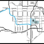 Aerial view driving directions to Red Rock Canyon from south of Russell Road, Las Vegas, highlighting highway exits and route to the conservation area entrance.