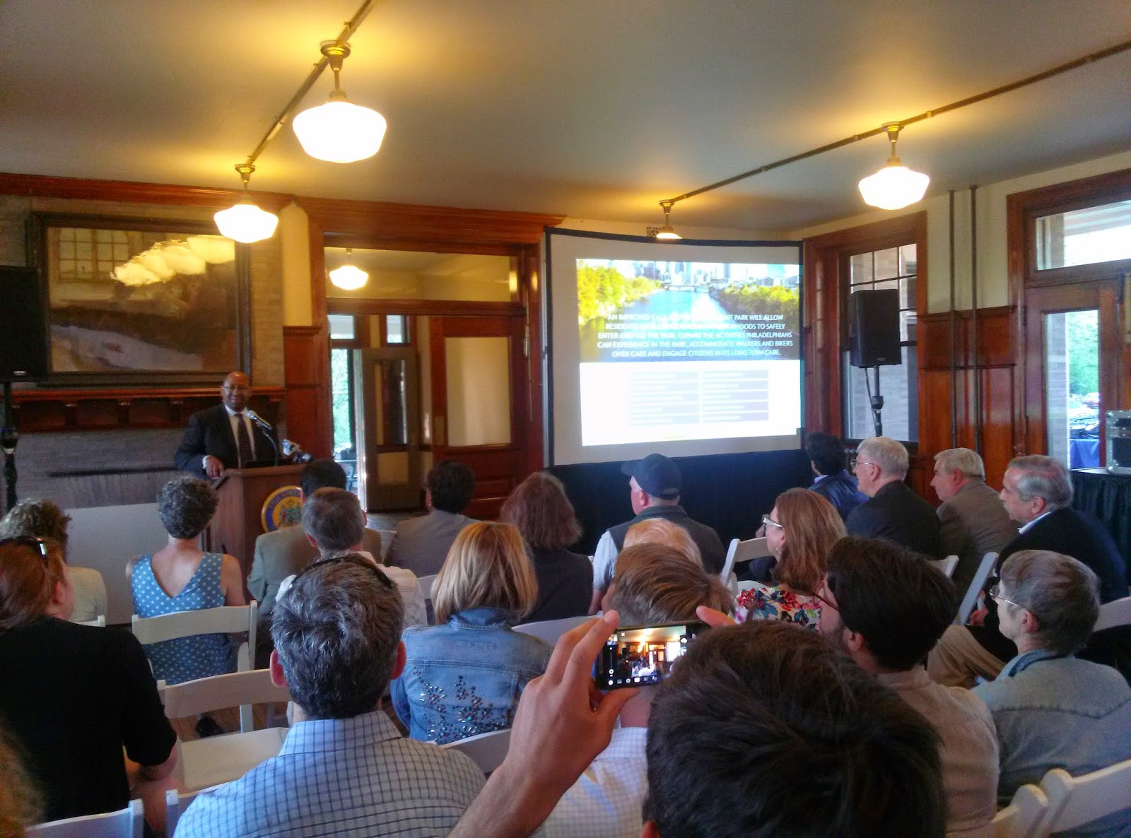 Philadelphia Mayor Michael Nutter discussing the Fairmount Park revitalization project, emphasizing the importance of preserving natural rock formations and green spaces like the Glendinning Rock Garden.