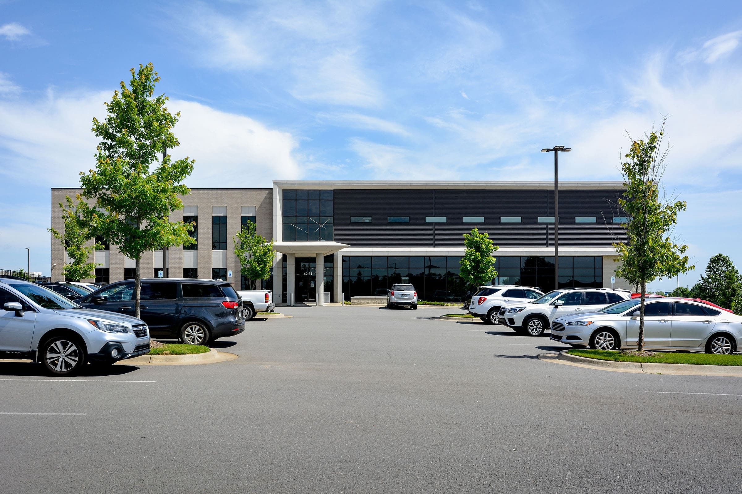 Front view of the UAMS Health Orthopaedic & Spine Clinic in North Little Rock, showcasing the modern facility before the installation of official signage.