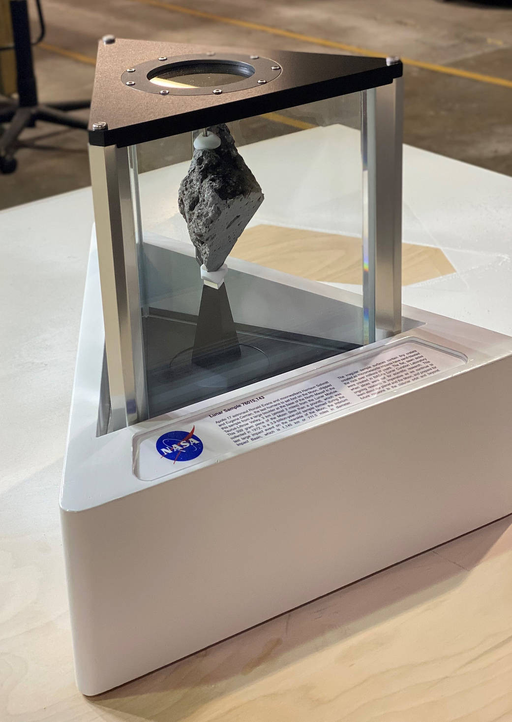 A lunar sample, a moon rock collected during the Apollo 17 mission, displayed in the Oval Office. This rock symbolizes American ambition in space exploration and serves as a tangible reminder of lunar geology.