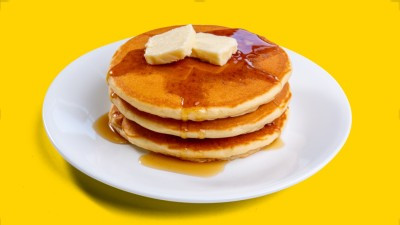 Fluffy morning pancakes at Taco Palenque Round Rock, served as a stack or with bacon and eggs.