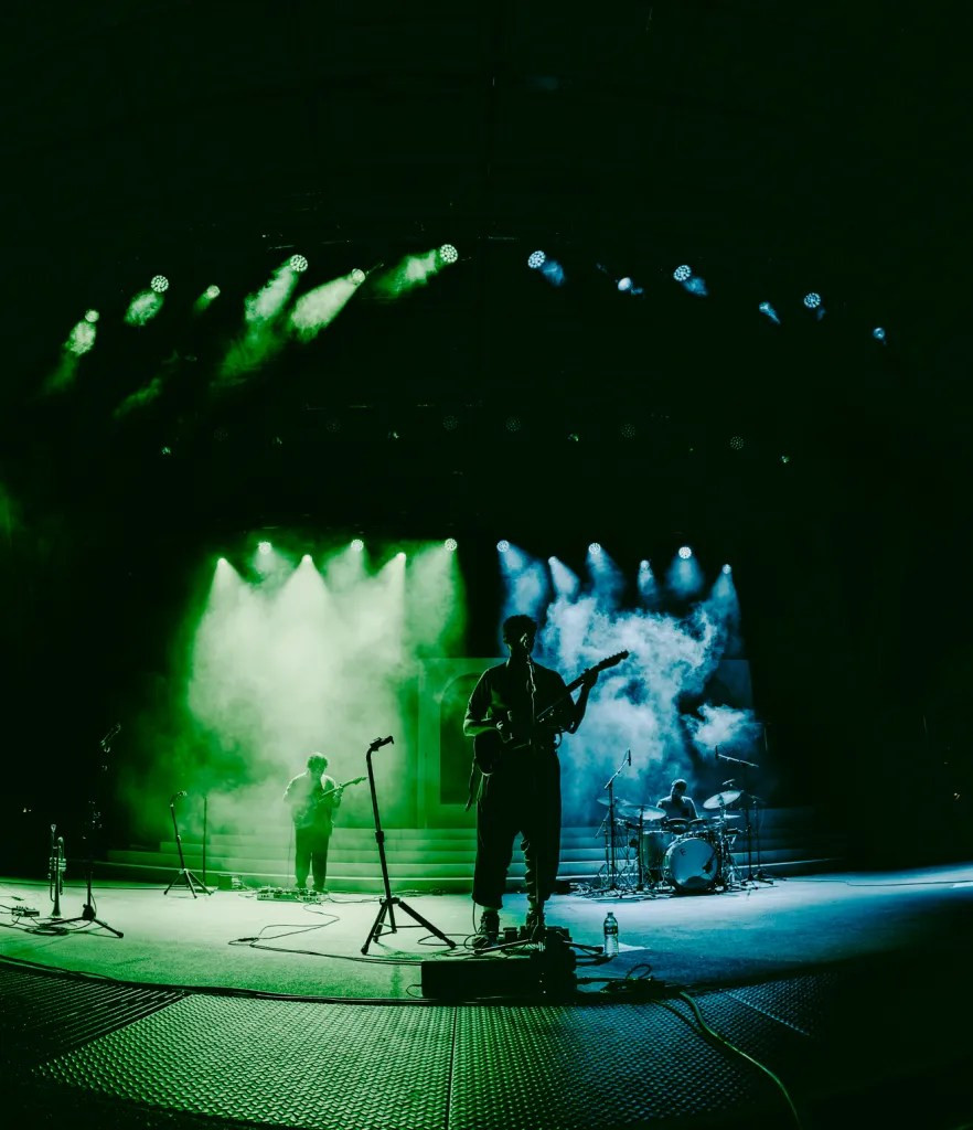 Peter Cat Recording Co. bassist contributing to their soulful sound at the Red Rocks concert.